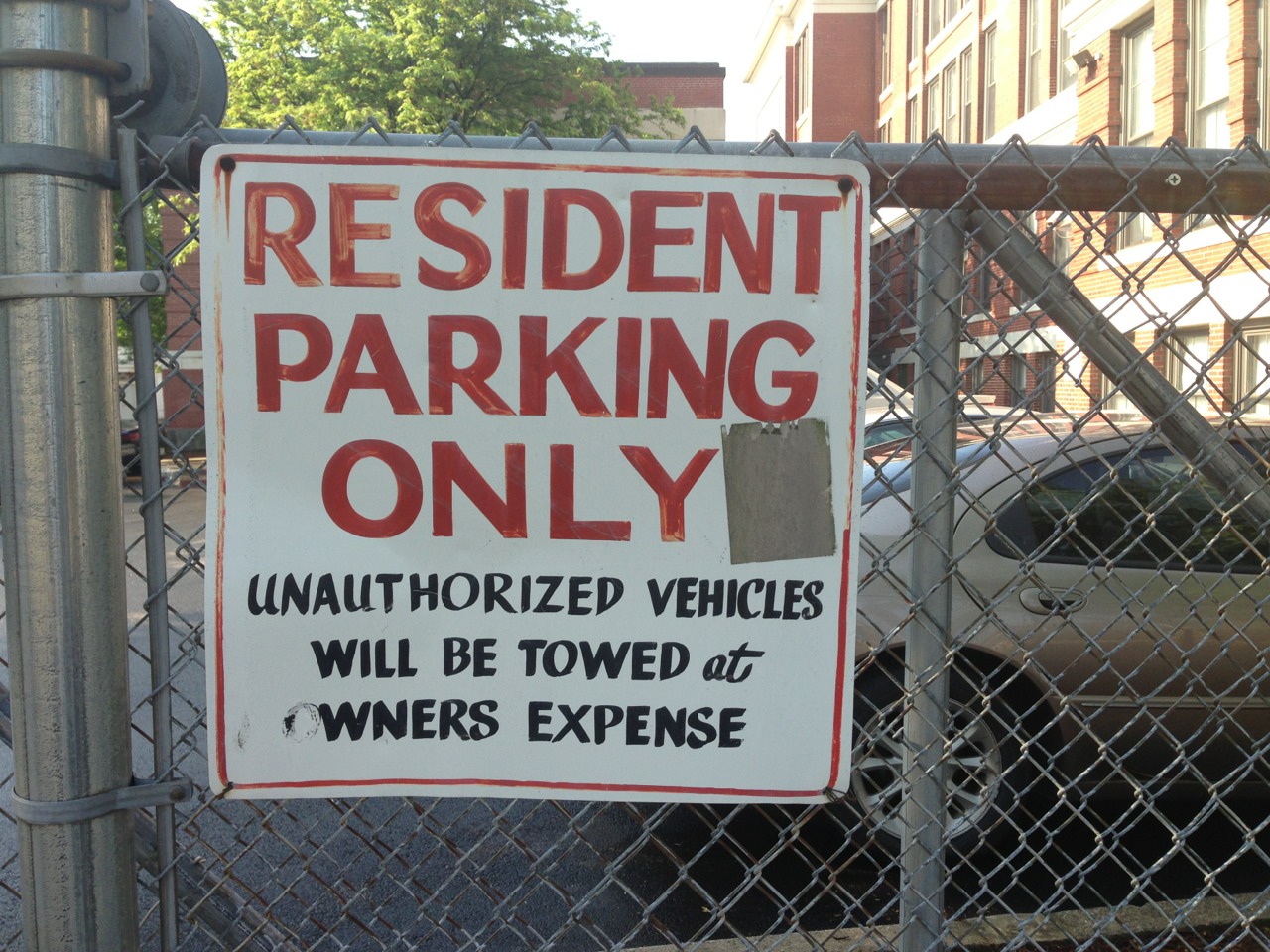 "RESIDENT PARKING ONLY / UNAUTHORIZED VEHICLES WILL BE TOWED at OWNERS EXPENSE"