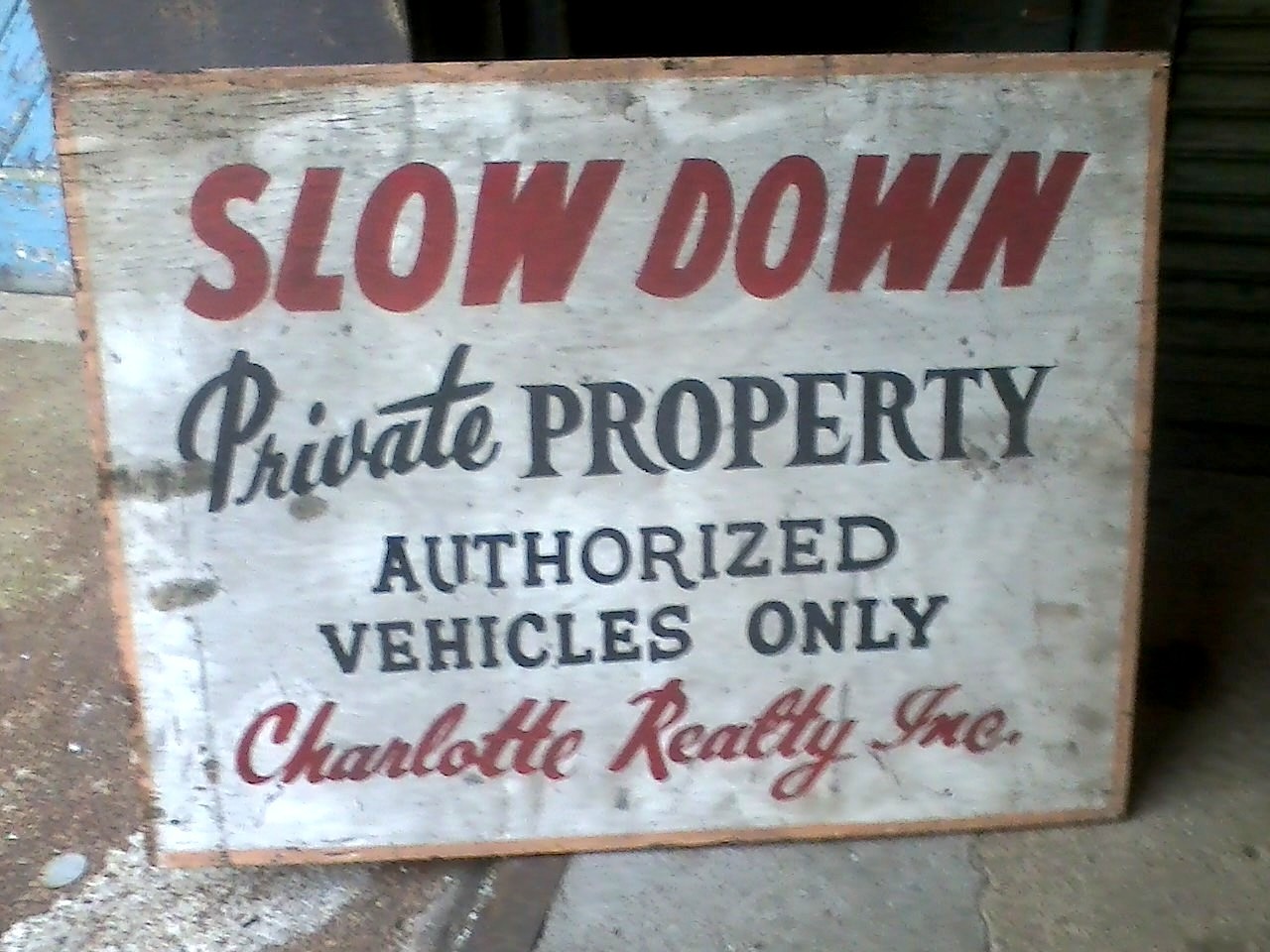 "SLOW DOWN / Private PROPERTY / AUTHORIZED VEHICLES ONLY / Charlotte Realty, Inc."