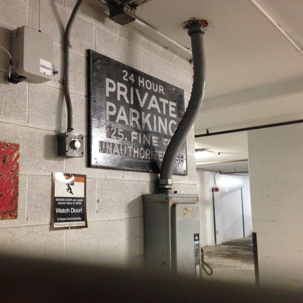 "24 HOUR PRIVATE PARKING $25. FINE FOR UNAUTHORIZED USE"